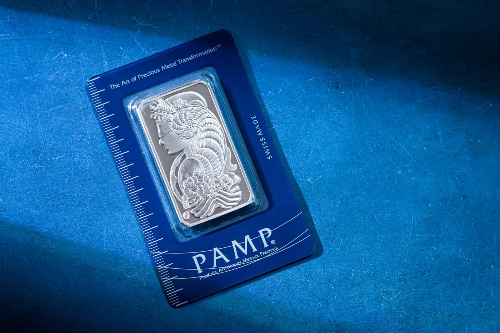Minted silver bullion bar in its assay card