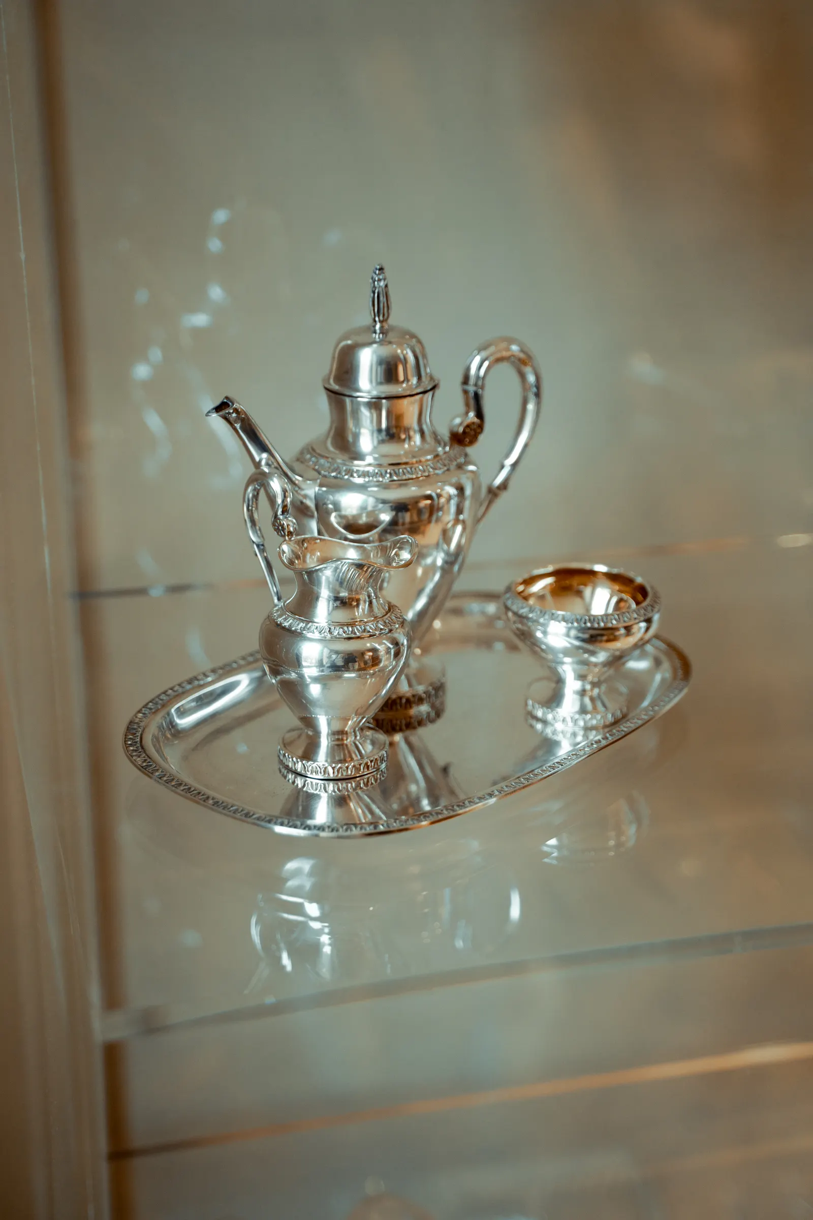 Polished sterling silver tea service on a tray