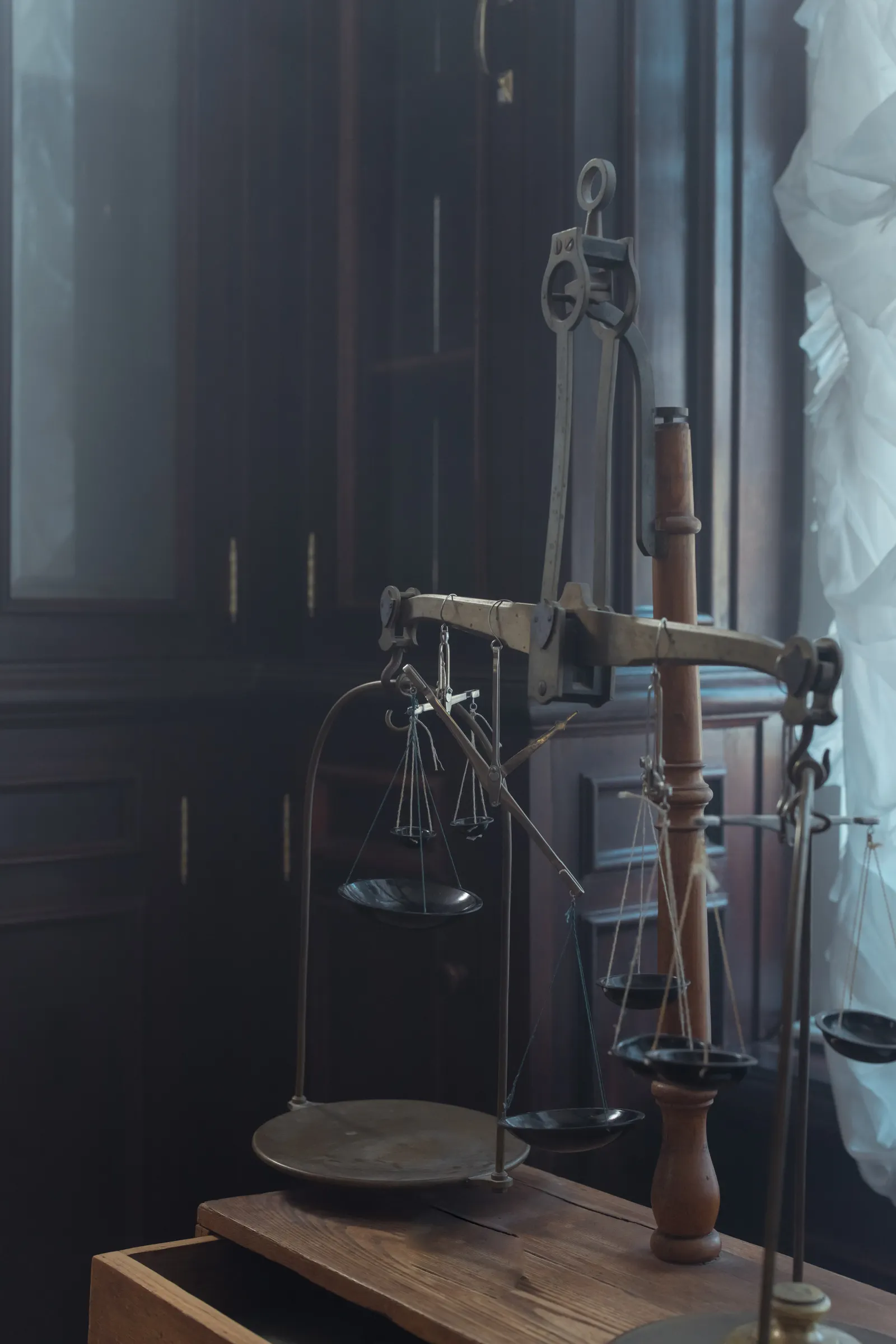 Antique brass balance scale in a dim interior